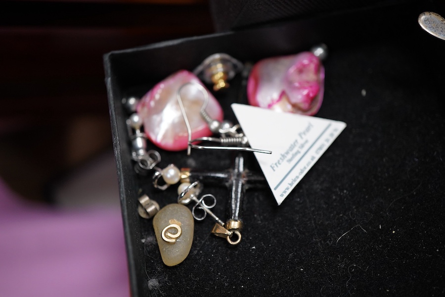 A cultured pearl necklace, composed of graduated cultured pearls of pale pink tint measuring approximately 11-12mm, to a spherical clasp stamped 14K; a black opal measuring approximatley 11 x 7mm, on a display cushion; a